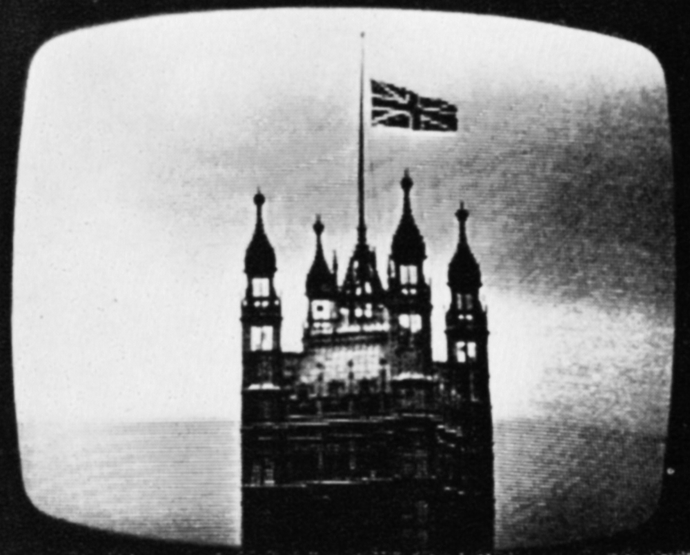 Tele-snap of flag at half mast on the Palace of Westminster