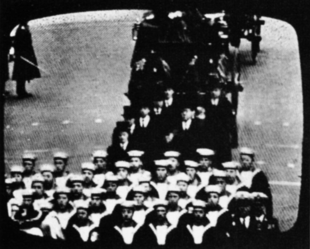 Tele-snap of sailors marching