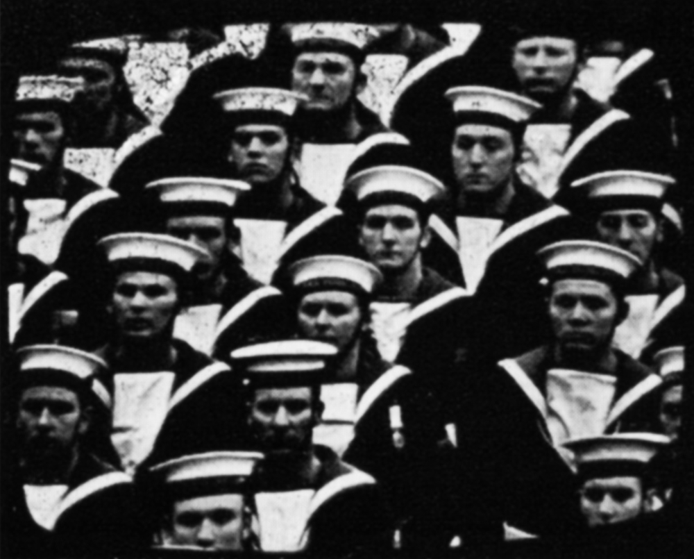 Tele-snap of sailors marching